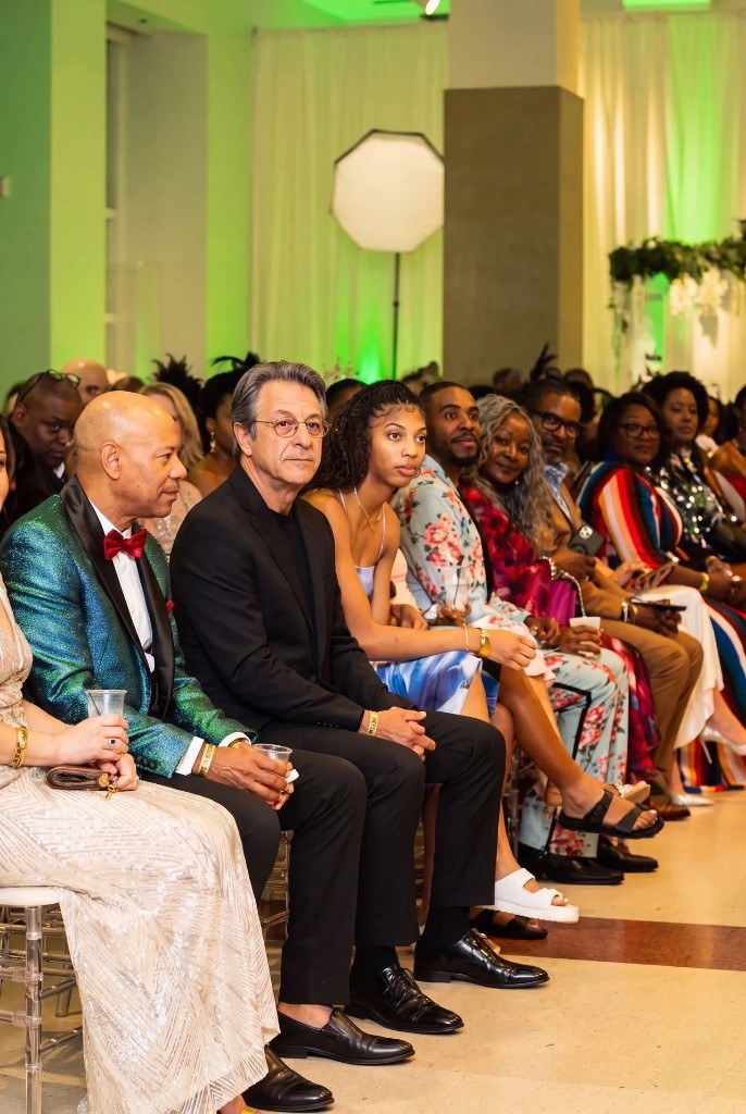 Egemen Mustafa Şener — seated in the front row at a runway show